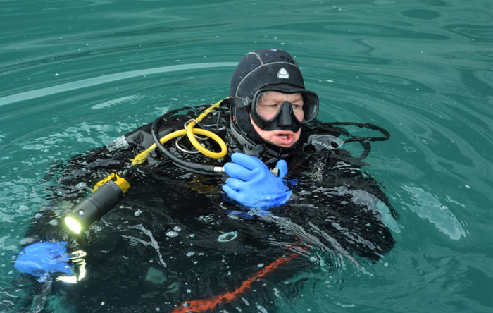 Dr. Kelley emerging from the icy waters of Glacier Bay National Park, during the Deepwater Exploration of Glacier Bay National Park expedition.