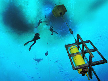 Dr. Amanda Kelley, Dr. Brenda Konar (University of Alaska Fairbanks), and science Diver Rob Robbins descend under the sea ice at Cape Evens Antarctica to retrieve a seaFET pH sensor after a year-long deployment.