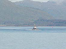 Tug boat coming to meet the R/V Atlantis