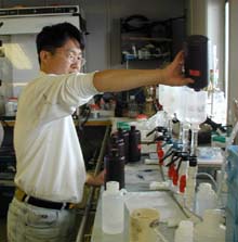 Sang Lee filters pytoplankton collected in the water samples.