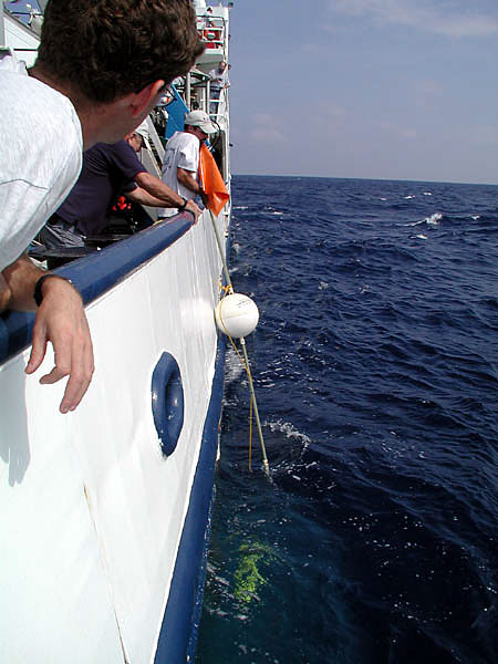crew members recover an acoustic mooring buoy