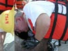 Jerry McLelland, reaches into the pipe dredge