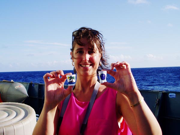 Melissa Ryan holds up two compressed cups