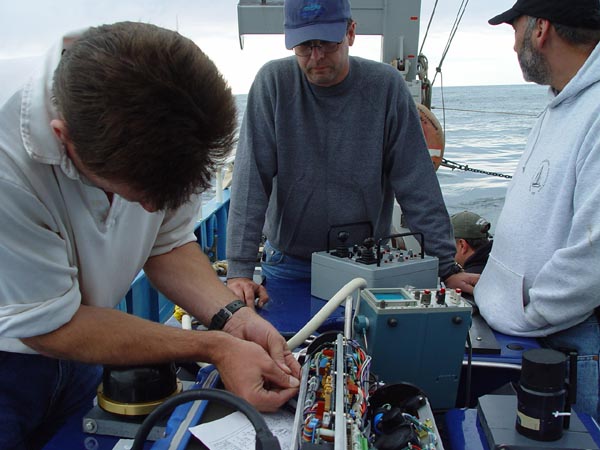 The ROV team works on the control and camera systems.