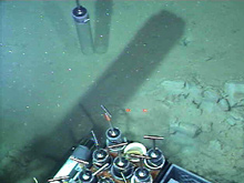 A push core being inserted into the thick muddy sediment at 2156 m during dive 3913.