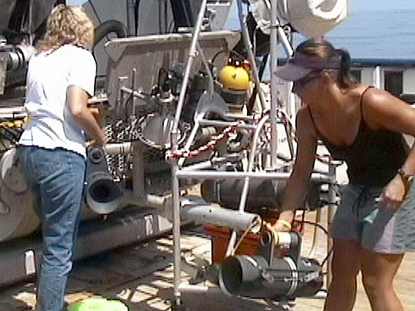 Tammy Frank and Nicole McMullen load baited benthic traps in the front basket of the Johnson-Sea-Link