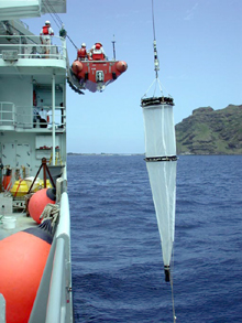plankton net is being deployed to collect near-surface plankton in Maug caldera