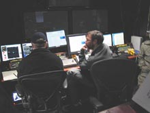 Discussing possible scenarios for the ROV power failures in the control van.