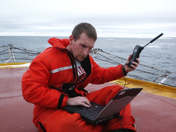 Jeremy Potter, of NOAA, transmits daily log entries via satellite phone.