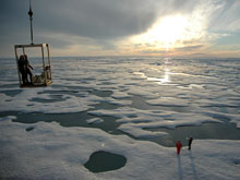  Scientists are lowered down onto Arctic ice in a man lift. Sea-ice supports a variety of life and is integral to the Arctic Ocean's food web. 