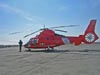 A US Coast Guard helicopter flies the equipment and scientists to the Coast Guard Cutter Healy.