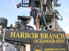 Submersible pilot Hugo Marrero checks the positioning of the LOLAR
on top of the JSL.. Submersible pilot Hugo Marrero checks the positioning of the LOLAR on top of the JSL.