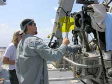 Dr. Mikhail Matz checking his yellow submersible light filters prior to launch