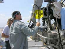 Dr. Mikhail Matz checking his yellow submersible light filters prior to launch Dr. Mikhail Matz checking his yellow submersible light filters prior to launch