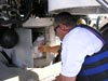 Submersible pilot Hugo Marrero places Styrofoam cups in the battery box of the Johnson-Sea-Link.