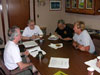 Dave Butterfield, Bob Embley, Gary Massoth, and Terry Kerby (chief Pisces pilot) discuss the hazards of diving on Monowai