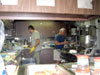 The galley crew (Paul Ramos and Jan Sobolewski ) of the K-o-K hard at work preparing and serving three meals a day.