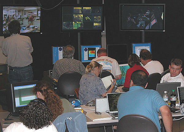 Scientists take their stations in UW's Science Control Center