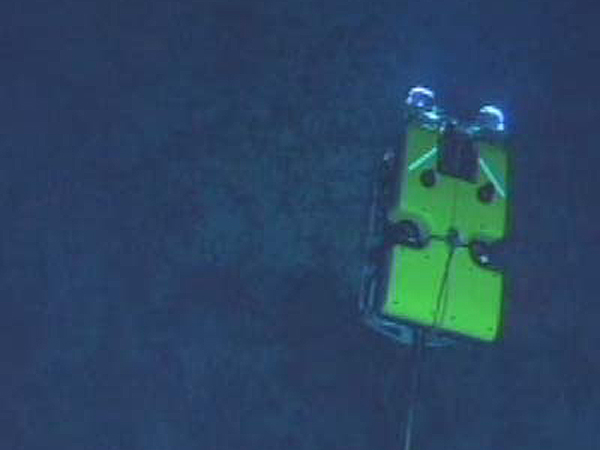 ROV Hercules attached by a long cable to ROV Argus