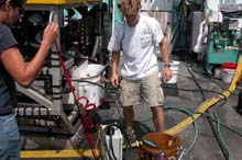 Todd Gregory of the University of Rhode Island checks out the ROV Hercules while Catalina Martinez, of NOAA looks on.