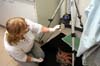 Paula Carlton, Teacher at Sea, photographs coral specimens in the Bio/Analytical Lab