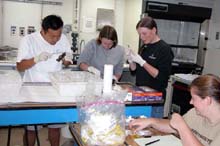 Walter Cho, Sarah L'Heureux, Rhian Waller and Kate Buckman, all of the Woods Hole Oceanographic Institution, process specimens.