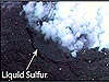 t Daikoku volcano, a black pool of liquid sulfur with a solidified sulfur crust.