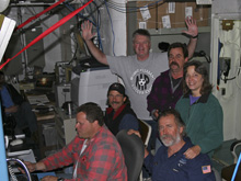 The Olympic Coast 2006 co-principal investigators and ROV team celebrating the first cruise sighting of the hard coral Lophelia pertusa.