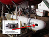 ABE AUV in its docking cradle.  Red arrow indicates the location of the fluxgate magnetometer.