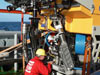 View of the front of the ROV, which consists of propellers, hydraulic pumps and lots of cameras, lights and electronics, as well as two arms.