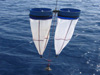 Paired bongo nets are lowered on a wire to a depth of 500 meters.