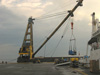 The barge-mounted crane lowers the 6-ton winch for the ROV down to the stern deck of the BRP Hydrographer Presbitero.