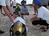 Students gather around as members of the science party prepare to launch the Gavia AUV at Pink Beach.