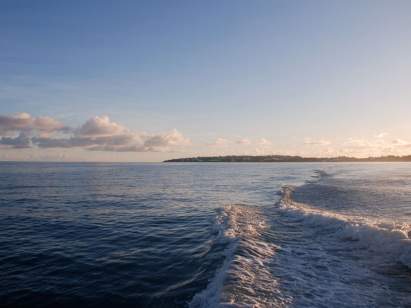 The wake of R/V Endurance leaving harbor in the early morning hours.  