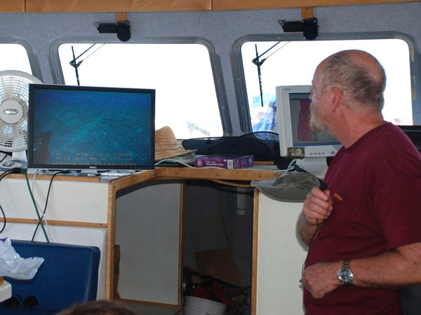 Dr. Tom Iliffe pays close attention as the ROV explores targets identified during the multi-beam survey as potential cave locations.