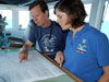 Operations Officer Lieutenant Nicole Manning confers with chief scientist Chuck Fisher about the next day’s dive plan. 
