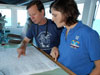 Operations Officer Lieutenant Nicole Manning confers with chief scientist Chuck Fisher about the next day’s dive plan.