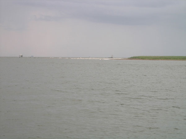 Before Hurricane Katrina a mile long beach existed at the mouth of South Pass.  Today the beach is gone. 