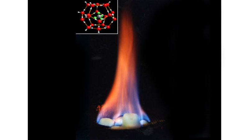 Figure 5. Methane hydrate will burn when lit. The inset image shows the structure of methane hydrate; the green and grey molecule in the center is methane and the red cage is the ice structure.