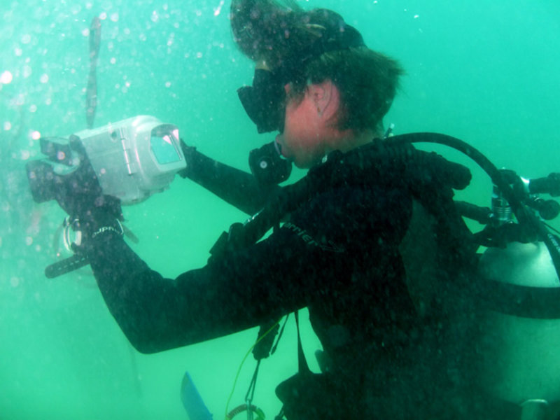 Amy Gusick takes underwater video with a camera lent to the project from the National Geographic Society.