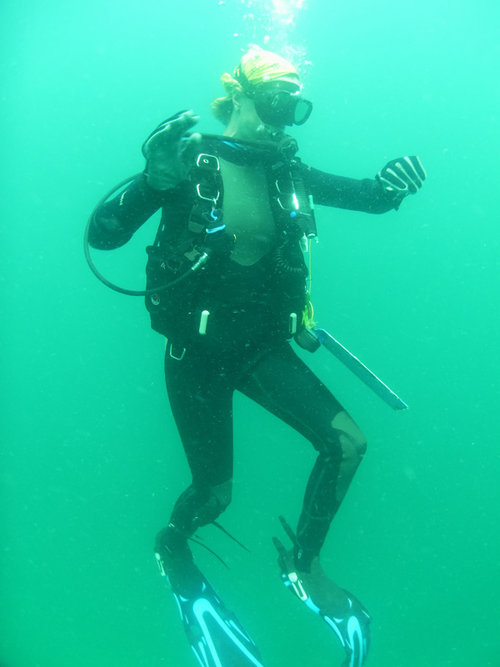 Amy Gusick monitors her dive computer as she descends to the research location 80 ft. below sea level.