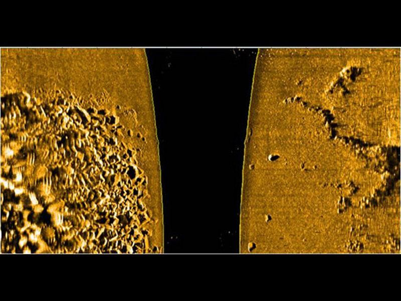 Side scan sonar media showing an area of rock fall along with a interesting linear rock formation that may be an ancient fishing weir. Areas like this one were targeted for further exploration during the diving phase.
