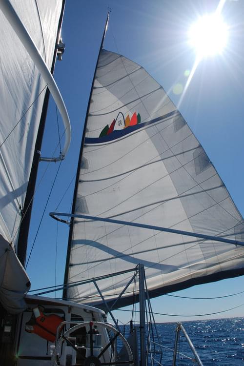 The main sail raised on the Baylis. The crew's survey is powered solely by wind.