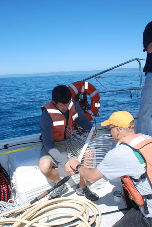 Jackson Currie and Sam Johnson from USGS prepare the “mini-sparker” for deployment. The “mini-sparker” sends out a “shot” every half or one second depending on water depth, and the sound of the shot bouncing back helps determine the hardness of the subsurface layers of the ocean bottom. Data from the “mini-sparker” creates an image of the cross section of the fault, revealing the structure of the fault and sediments surrounding it.