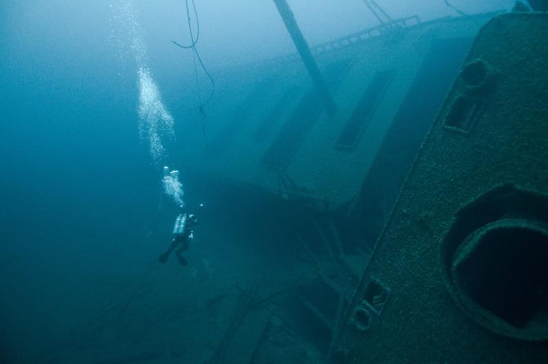 Protected from the high-energy of a shallow-water environment, deepwater shipwrecks are often very intact. Shipwrecks in this type of environment are true time capsules, providing unique and exciting archeological, historical, and recreational opportunities. Pictured here is the 300-foot long bulk freighter Norman, which sank in 1895. Resting in 64 meters (210 feet) of water just outside the current sanctuary boundaries, the wreck site is among the most exciting dives in the Great Lakes.