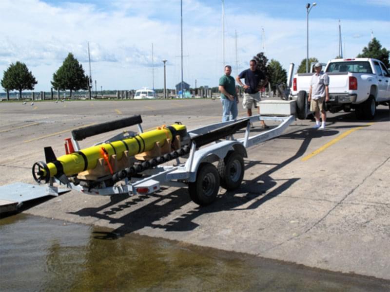 The Alpena Marina is within a few minutes of the NOAA facility. A very simple and effective technique to transport the AUV to the marina and launch it was to use a standard boat trailer. The procedure was straight forward, with no high crane lifts or jarring motions. After launch, the AUV’s remote control was used to motor it over to the support ship where it was lifted onboard with the ship’s crane.