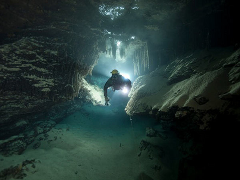 Brian Kakuk navigating Green Bay Cave System.