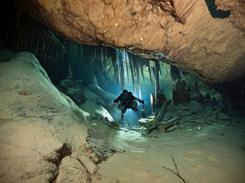 Silouhette of Tom Iliffe at Deep Blue Cave, Walsingham System.