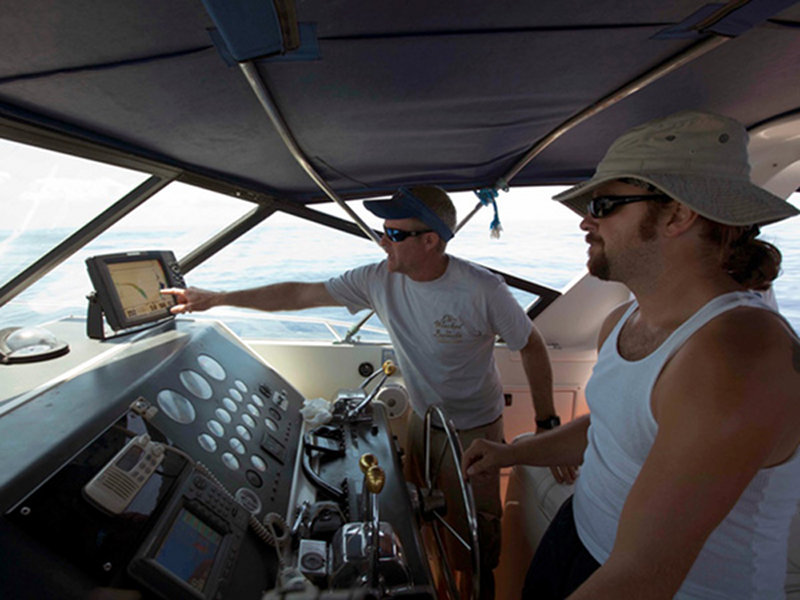Captain Graham Maddocks and Brett Gonzalez select a steep drop on the bottom finder before deploying the mooring.