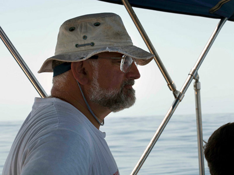 Safety diver and local Bermudian, Gil Nolan, keeps watch until the divers are ready to plunge.